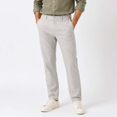 light gray pants and a green shirt